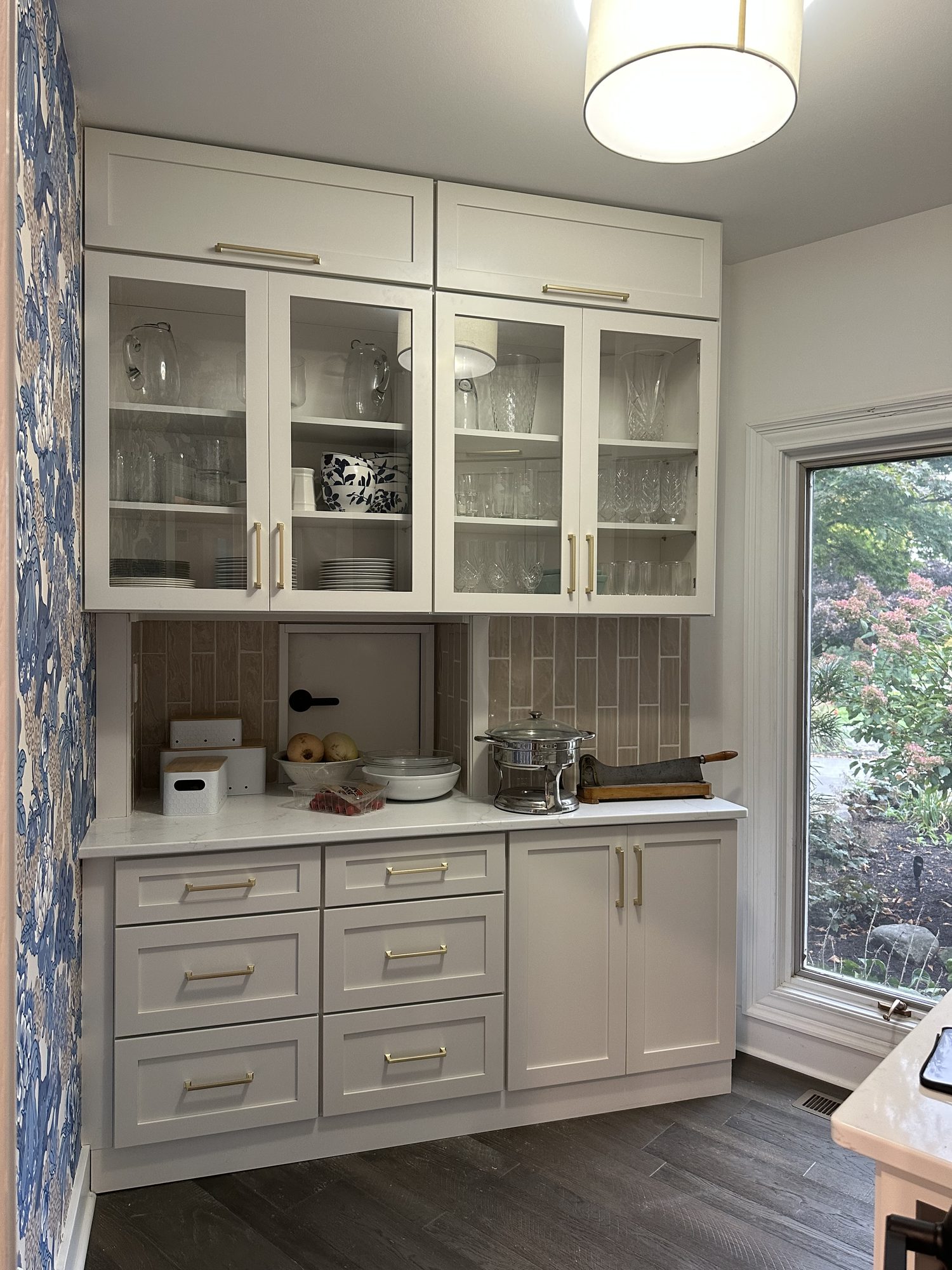 Finished glass-front cabinet wall